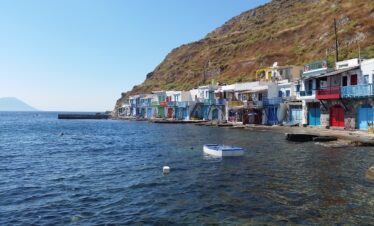 Klima colorful boat garages basking in the sunlight.