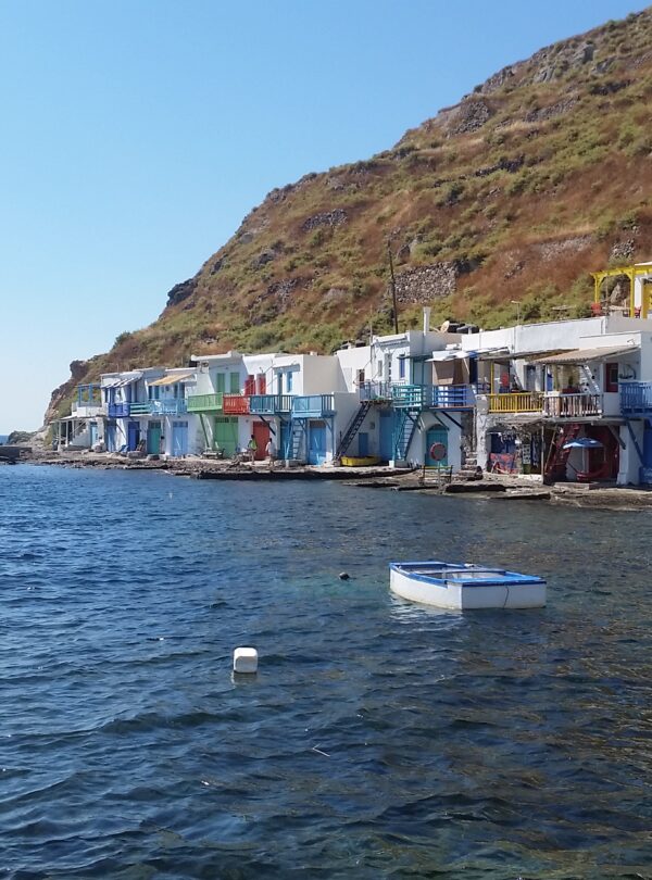 Klima colorful boat garages basking in the sunlight.