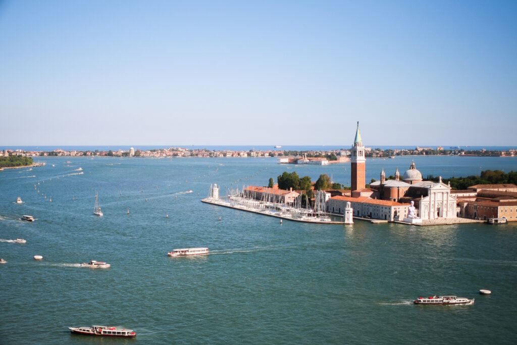 View over Venetian Lagoon focused on Church of San Giorgio Maggiore.