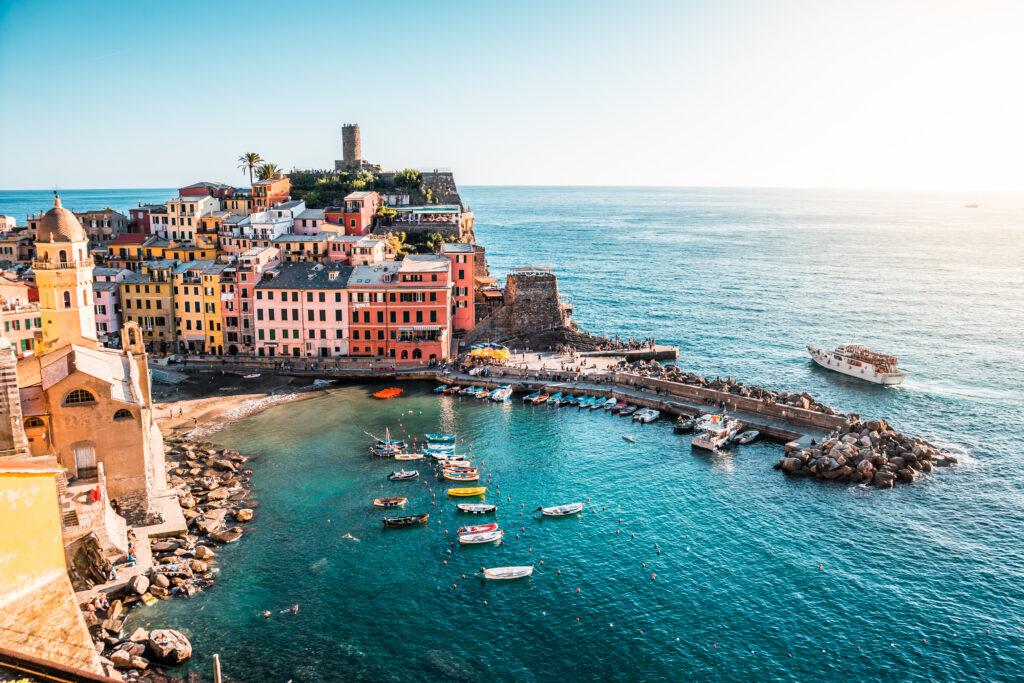 Vernazza's harbor sits beside colorful buildings.