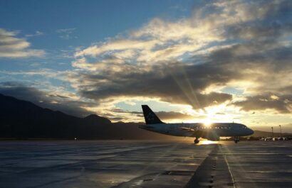 plane with sunlight shining behind the clouds