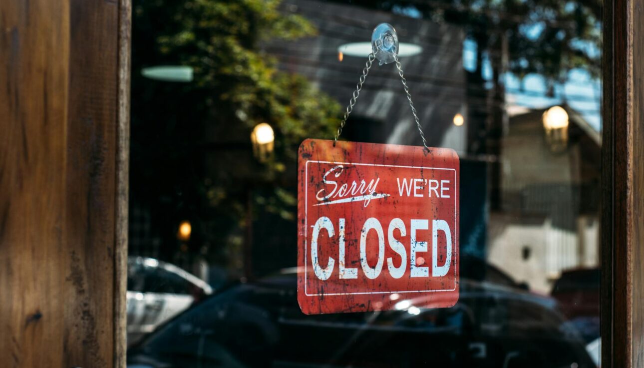 "sorry, we're closed" sign